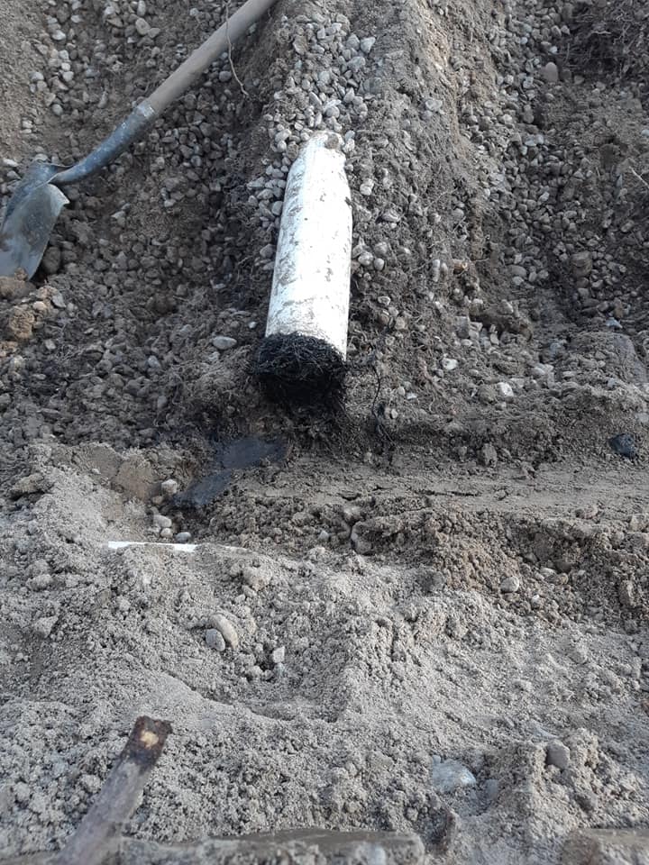 picture of a septic bed pipe that is plugged solid